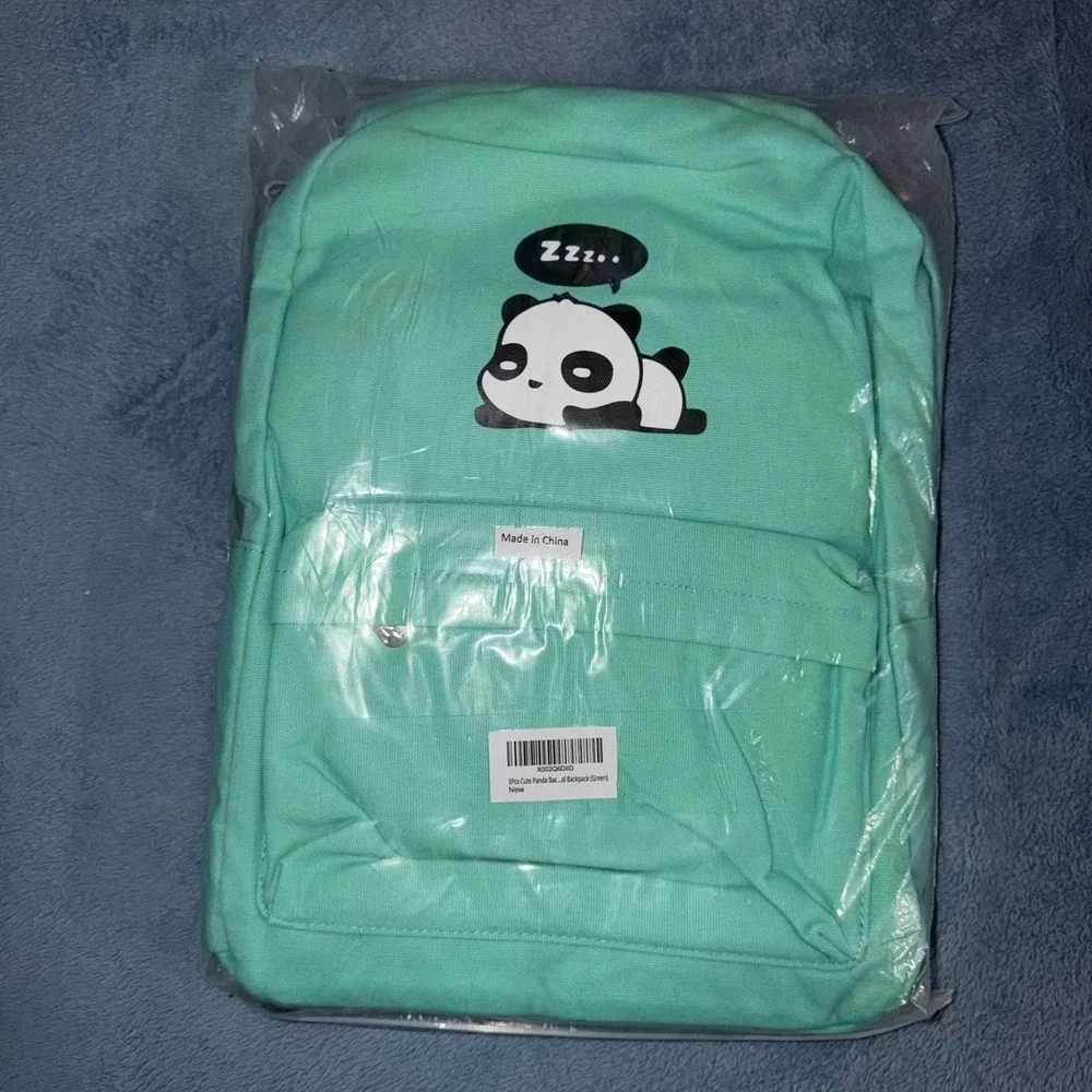 Green backpack with white panda graphics